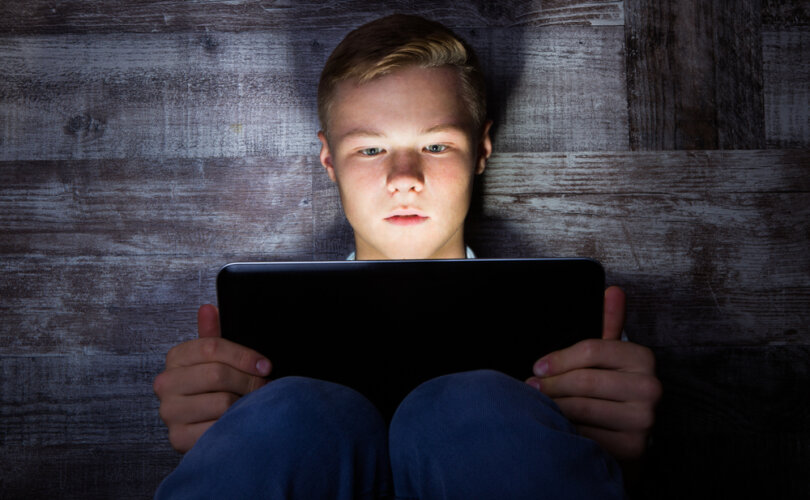 Teenage,Boy,Using,Laptop