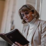 Finnish MP Päivi Räsänen blocked from entering UK for quoting Bible on marriage paivi-sitting-bible